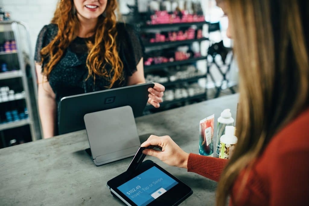 Woman checking out at counter